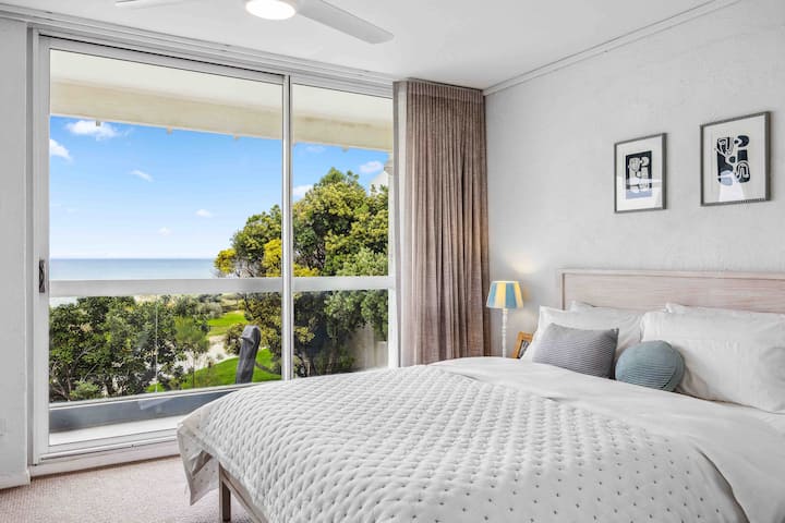 Bedroom one with a sea view, ensuite and built in wardrobes