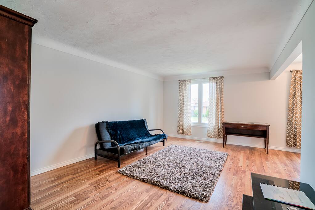 living room, furnished with a living room table, a TV stand etc.