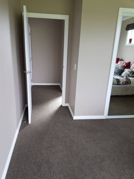 Hall with door to ensuite bathroom & connection to main house