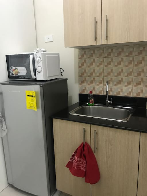 Kitchen with ref, microwave and electric stove