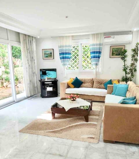 Beautiful upstairs villa with garden and parking