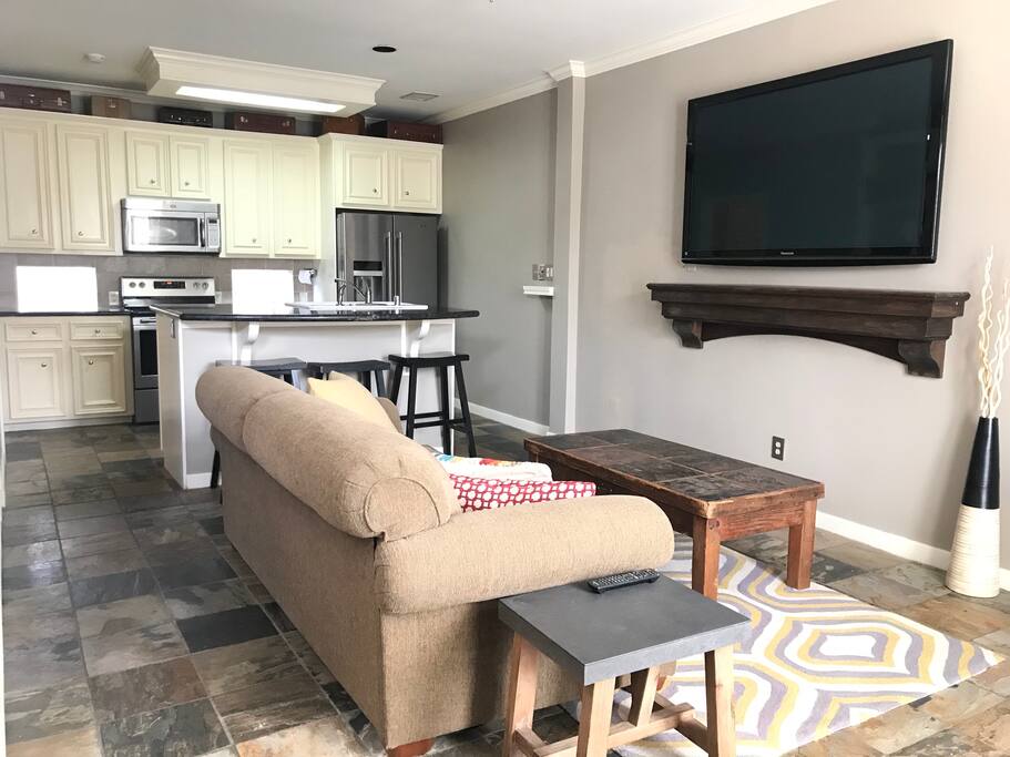 Living room with kitchen island. Perfect for entertaining.