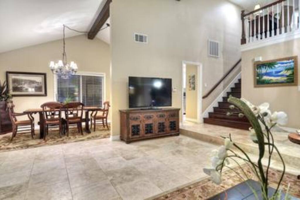 Unit A: View from living room toward TV and dining room
