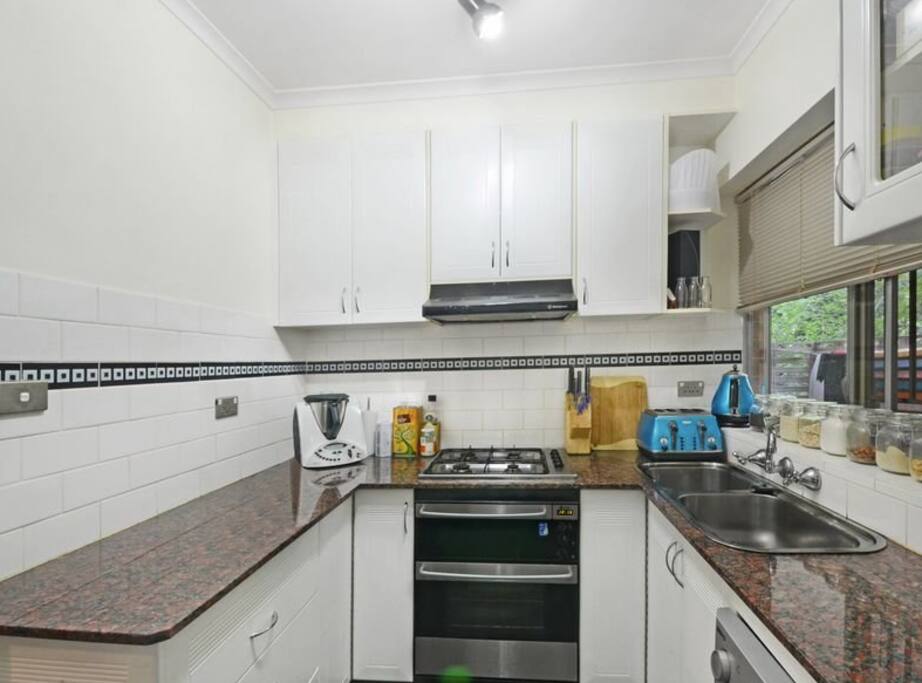 Kitchen with dishwasher and gas cooking facilities