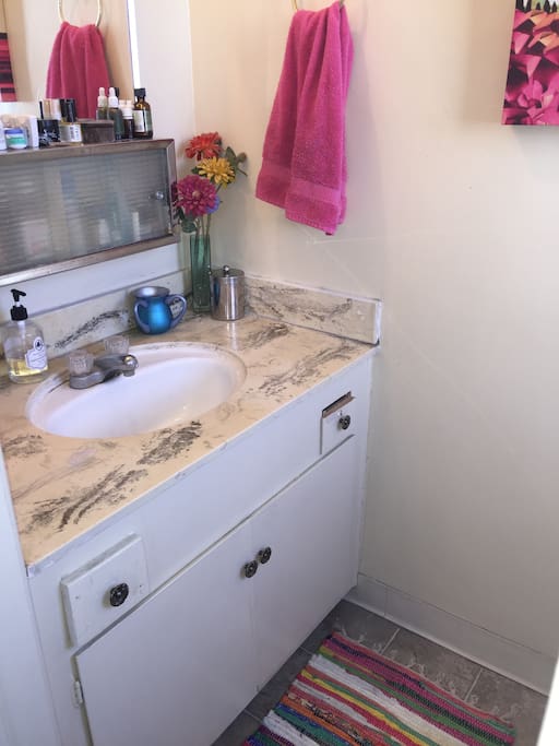 Sink, toilet and mirror in half bathroom