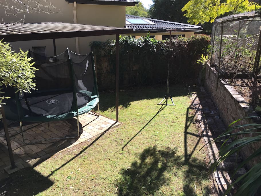 The lower garden holds the carport, there is also a basketball hoop.