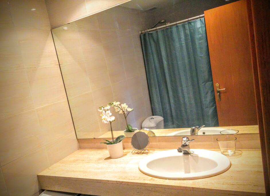 Large bathroom in suite with bathtub