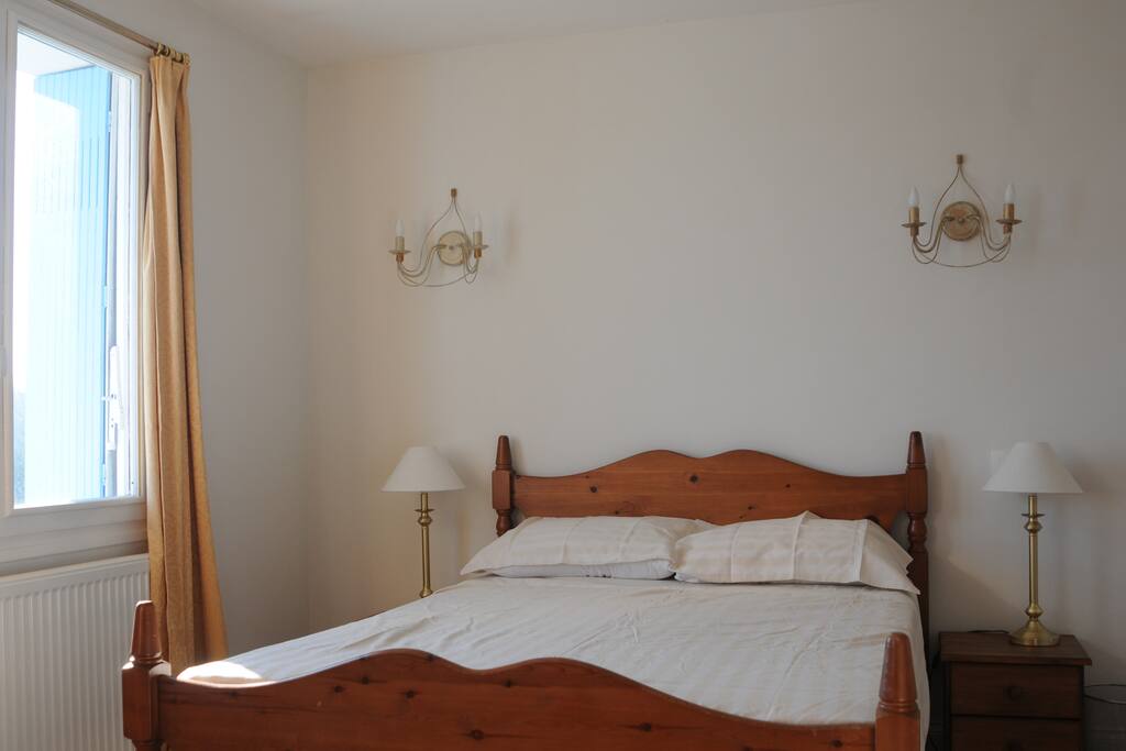 The spacious double bedroom is bright and sunny with amazing views of the countryside