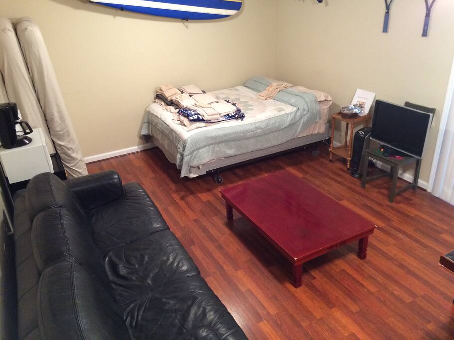 Large private bedroom with queen bed and couch