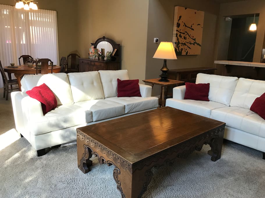 The family room features two sofas that comfortably seat five to six people. The television swivels to face the family room.