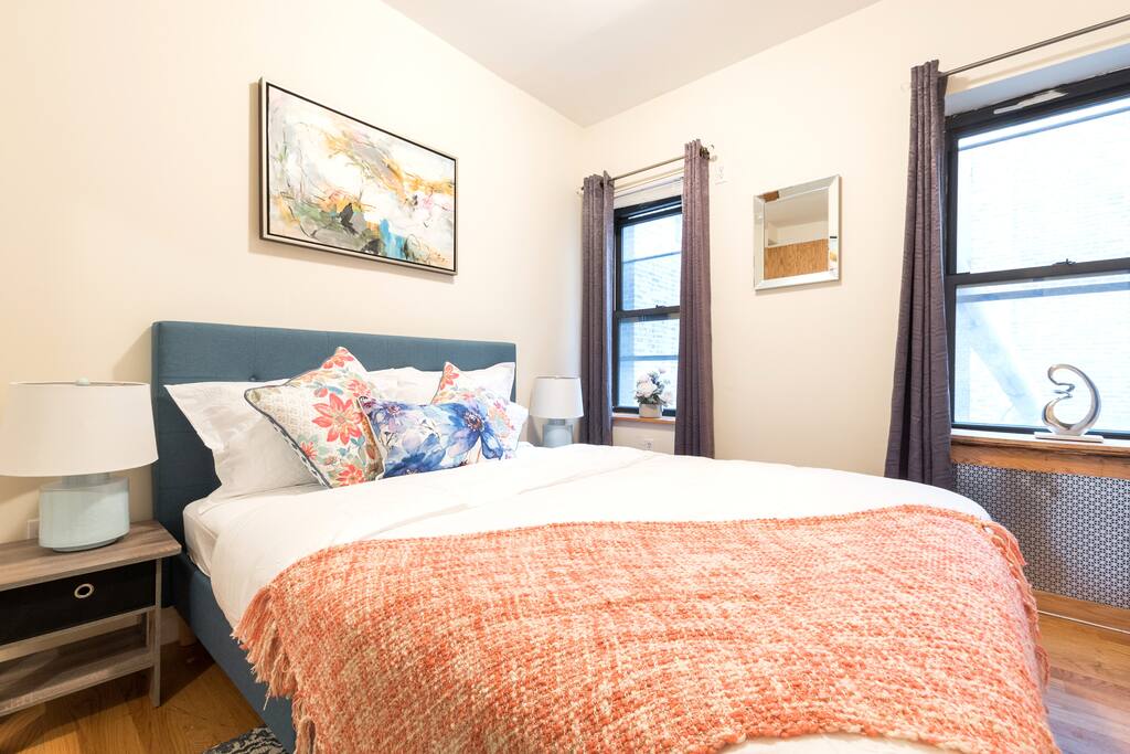 Gorgeous Master Bedroom featuring New SoHo Queen Bed and modern art work, with 2 big windows providing ample natural light