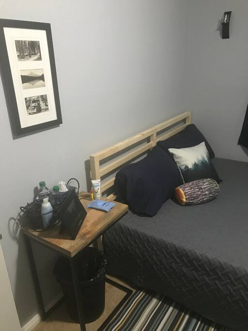 Queen Bed with Side Table and Alarm Clock