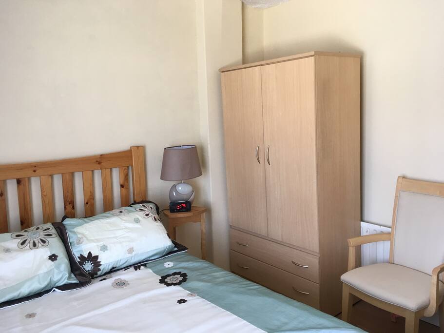 Alarm clock, wardrobe with plenty of storage