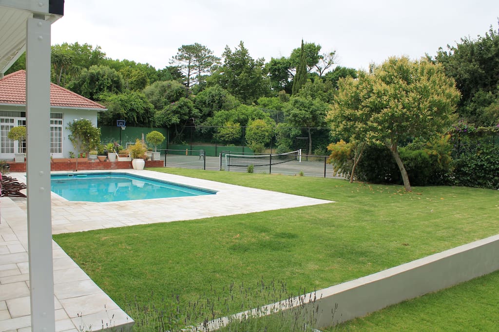 large swimming pool and tennis court