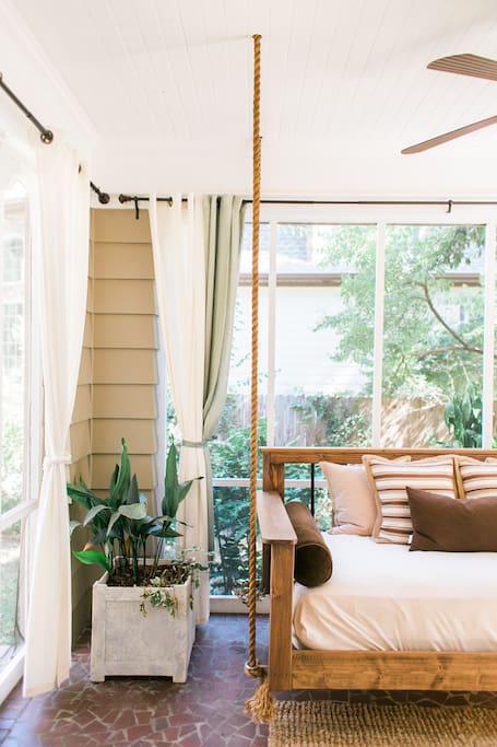 Hanging bed swing on the screened in porch