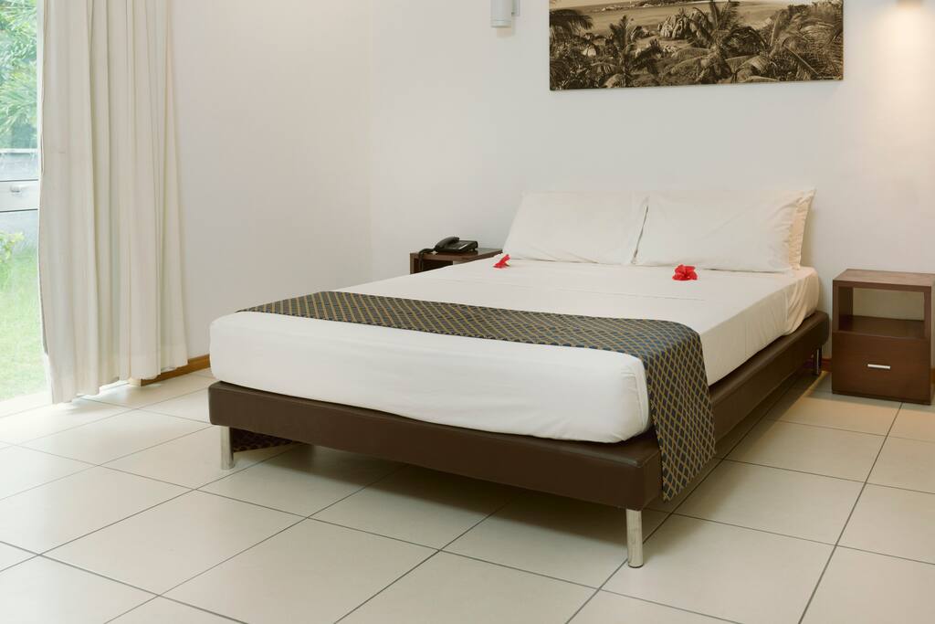 Bedroom with double bed and bedside table