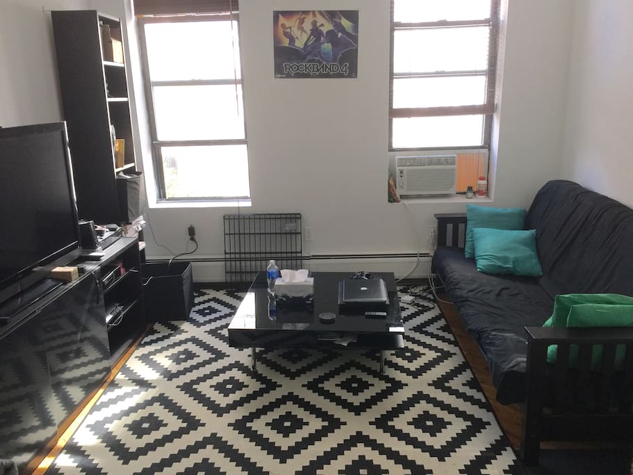 Airy, bright living room with coffee table for all your lounging needs.