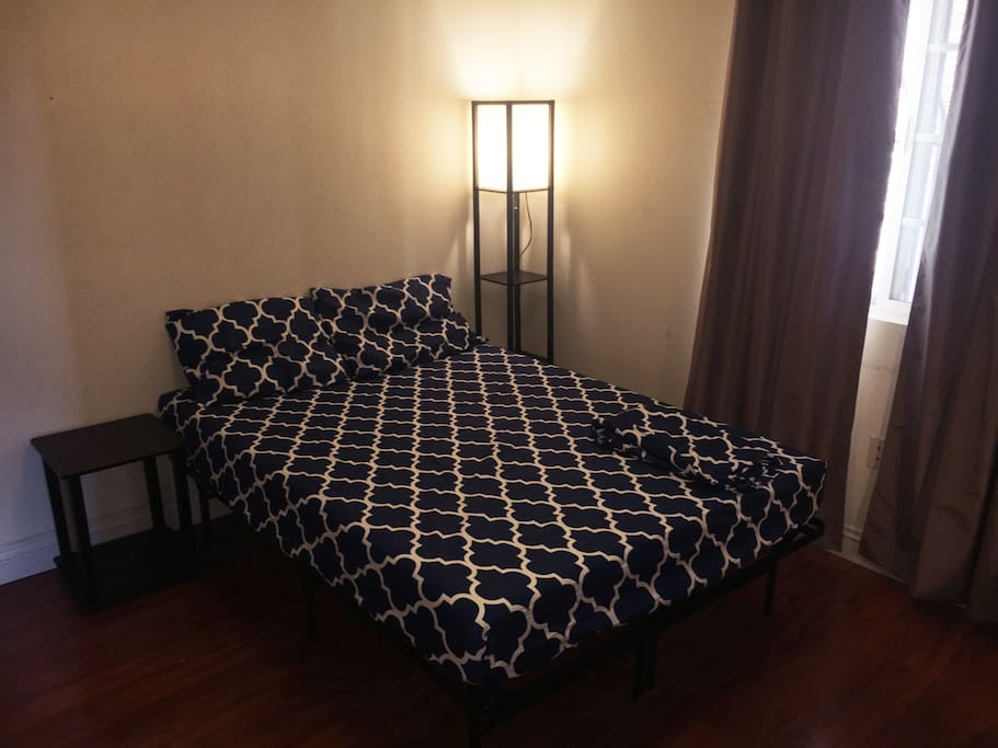 A full-sized bed with a new memory foam mattress. Bed sheets provided.