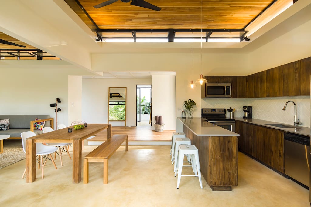 Kitchen with all modern appliances, opens up to the pool deck