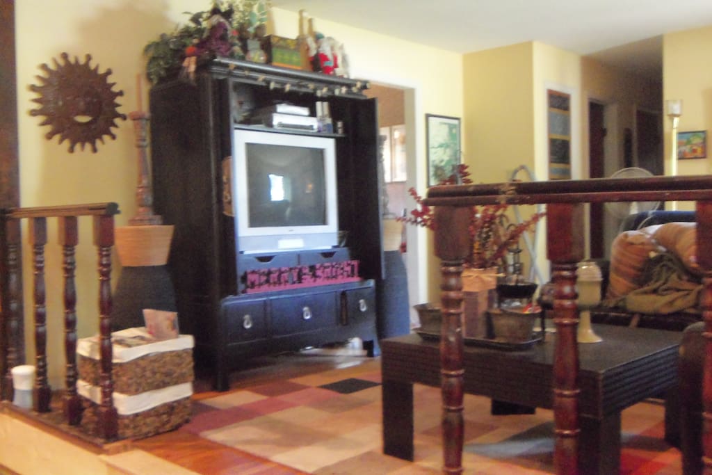 Living Room with t.v. and a host of DVD's and VHS tapes to view.