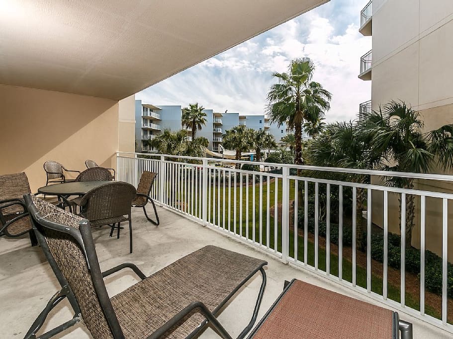 View from Master Bedroom side of balcony showing dining table and chase lounges!