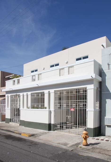 Street view of the beautiful, fully renovated early 20th century Caribbean style house.