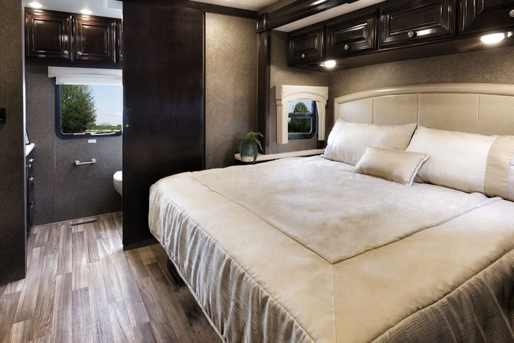 King Bed in the rear of the RV