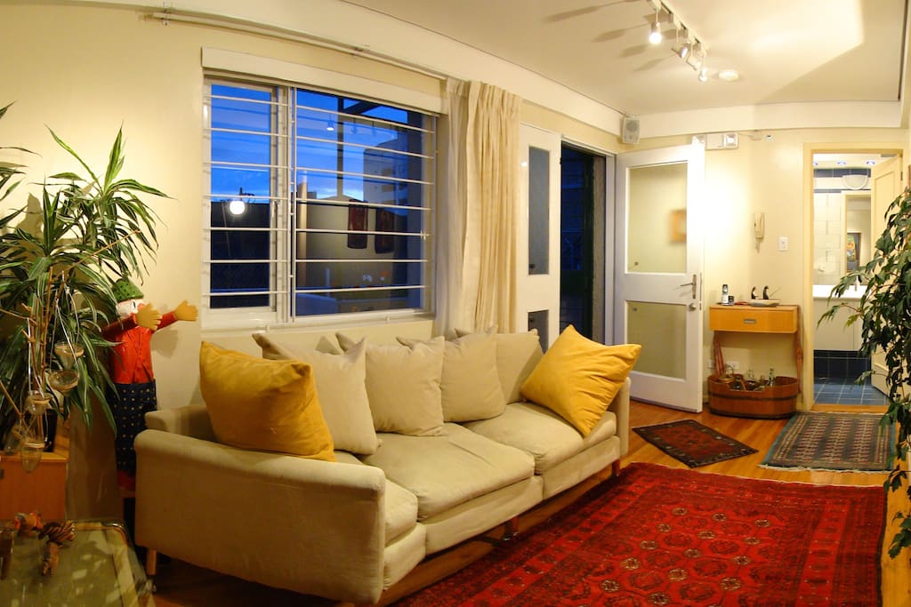 Living area towards apartment entrance and bathroom doors