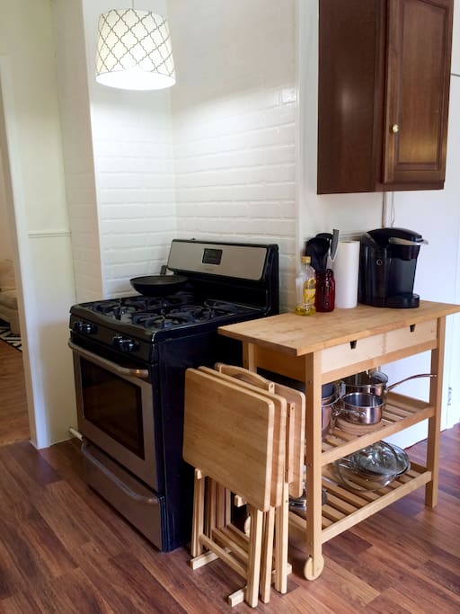 Full sized stove and oven in eat-in kitchen provides plenty of space to work and cook