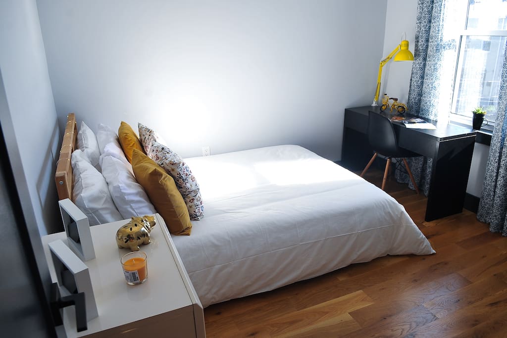 Super comfortable bed and lots of natural sunlight in your private bedroom.