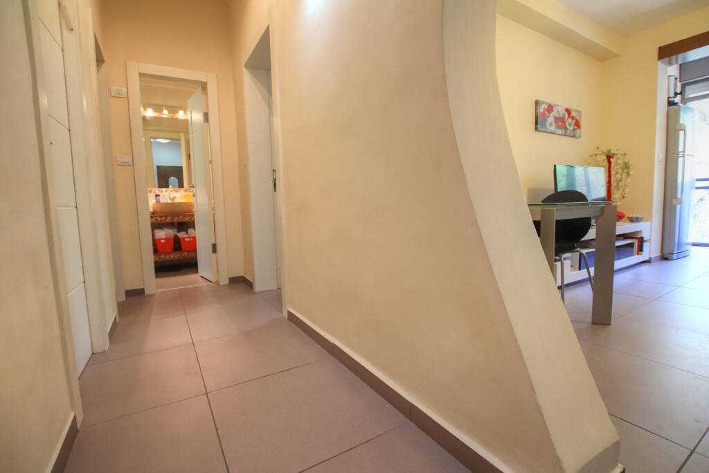 In between bedrooms and living room area