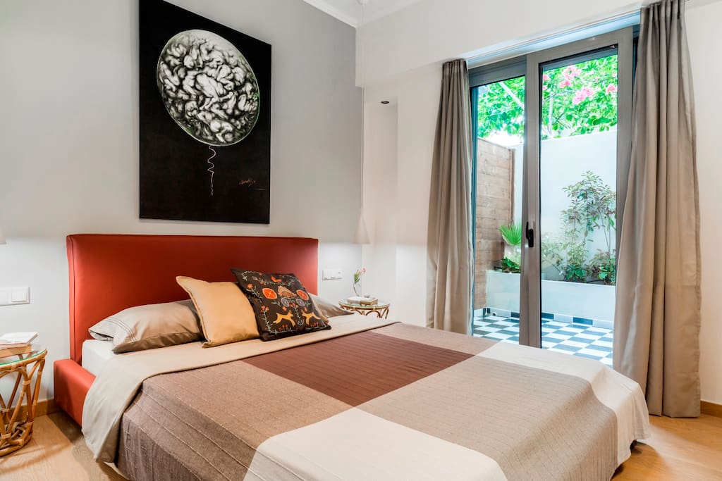 Master Bedroom with a yard view