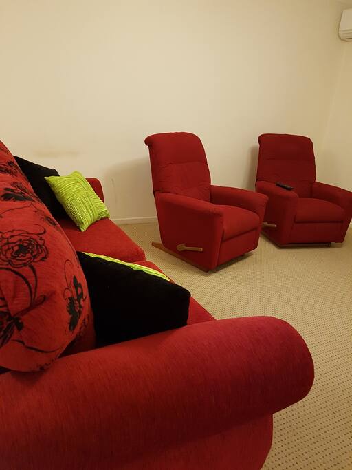 2 recliner chairs for relaxing on.
