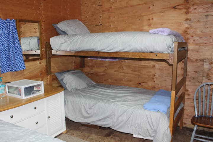 New linens and new curtains give this rustic cabin a clean, fresh look.