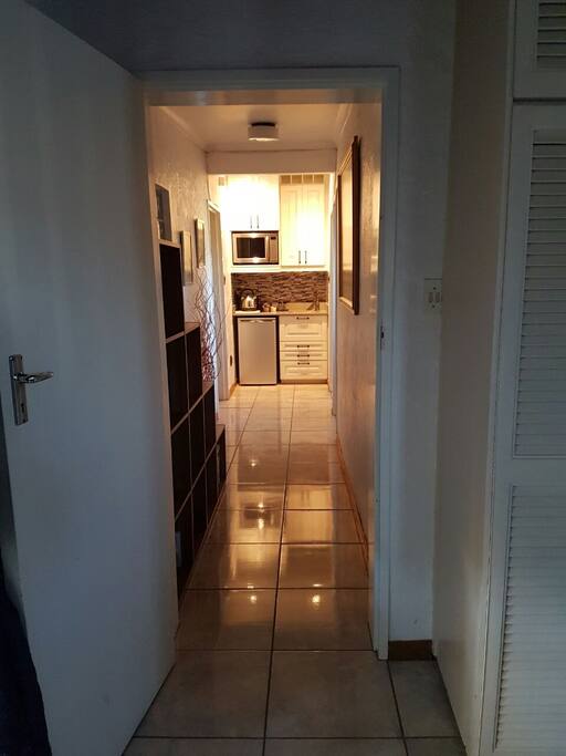 Passage leading from main bedroom to kitchenette