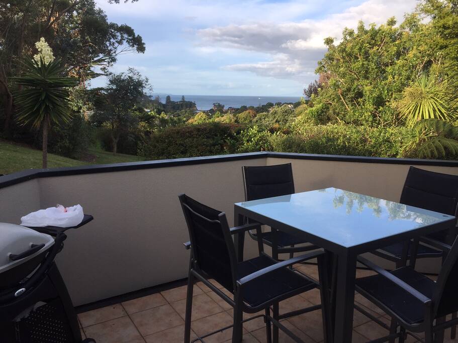 Outdoor upstairs deck withbbq and seating