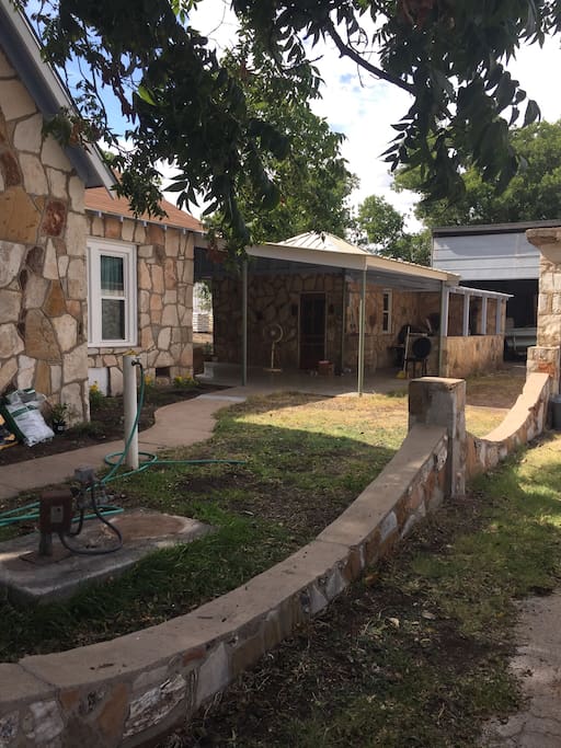 Side yard and entrance into back pavilion.