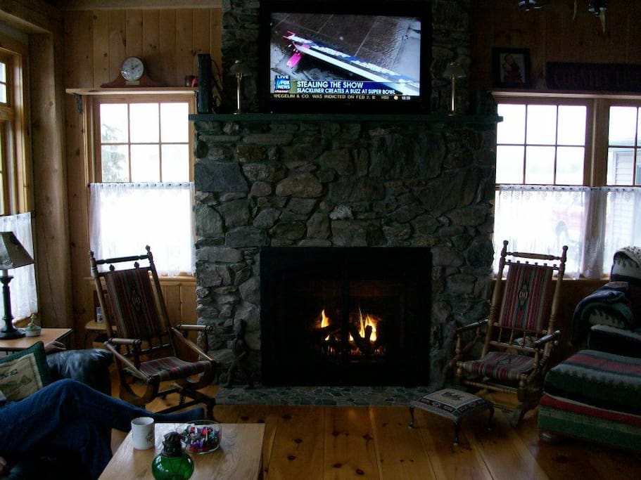 Relax in front of the gas fireplace after a day in town.