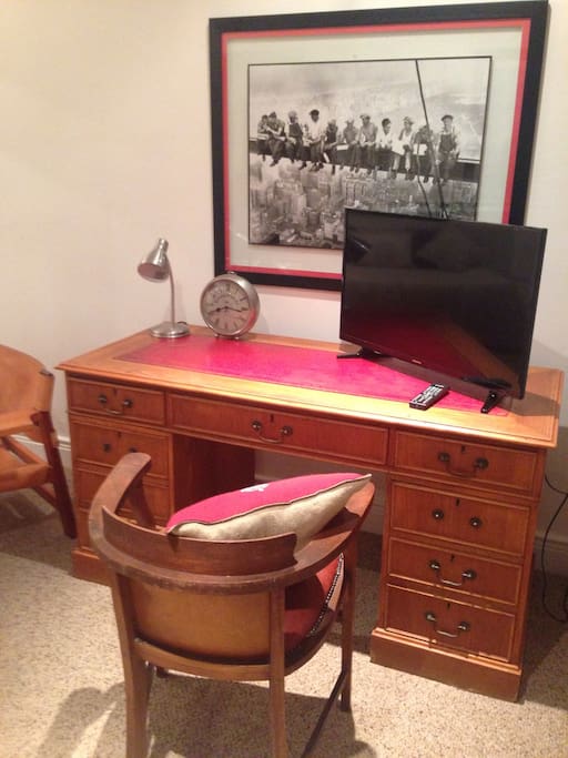 Leather topped Desk & TV area with full DSTV service.