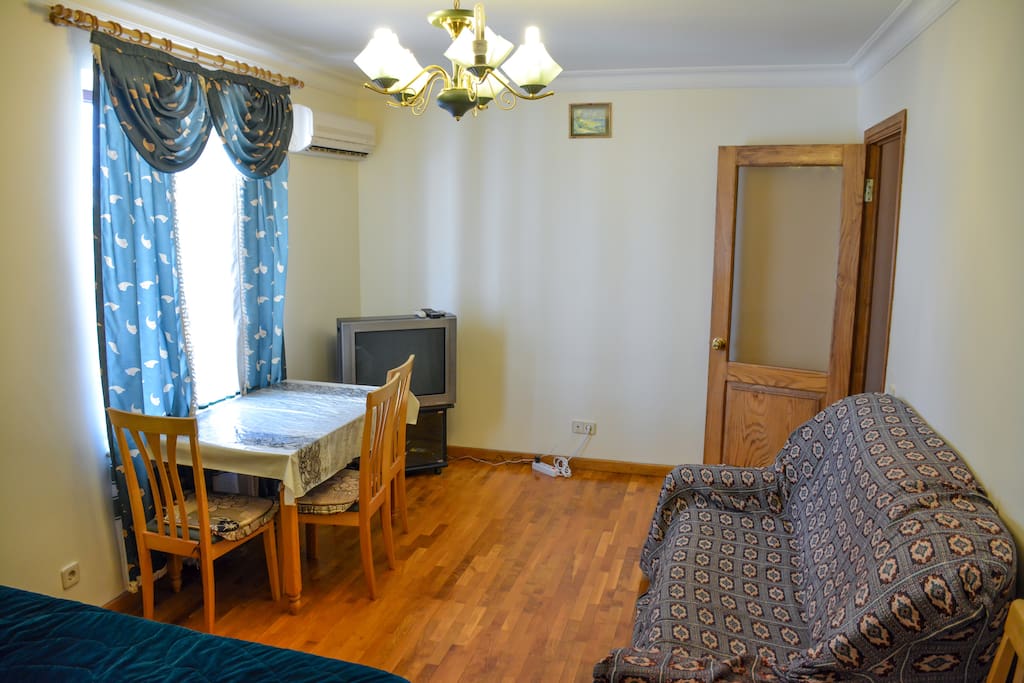 Air conditioning, TV, table with 4 chairs