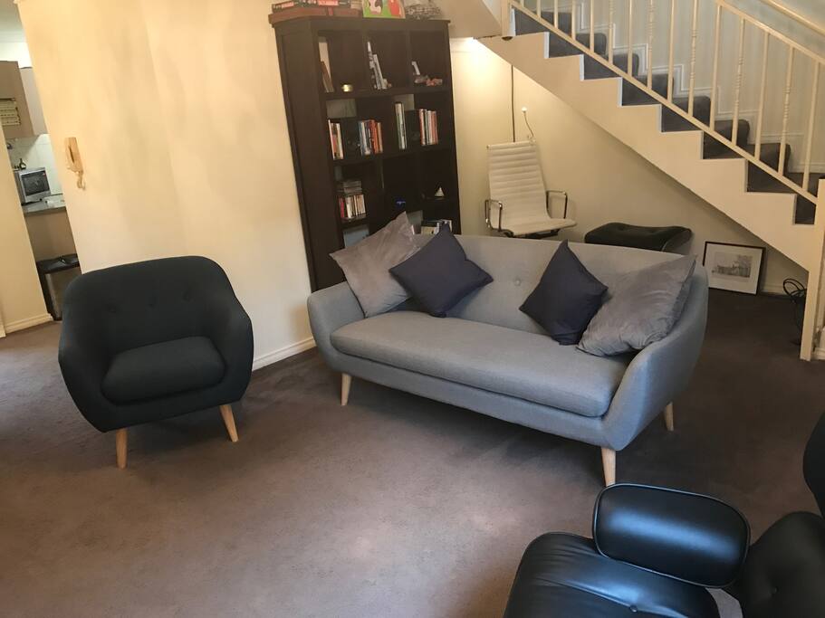 Lounge from window with reading nook behind sofa
