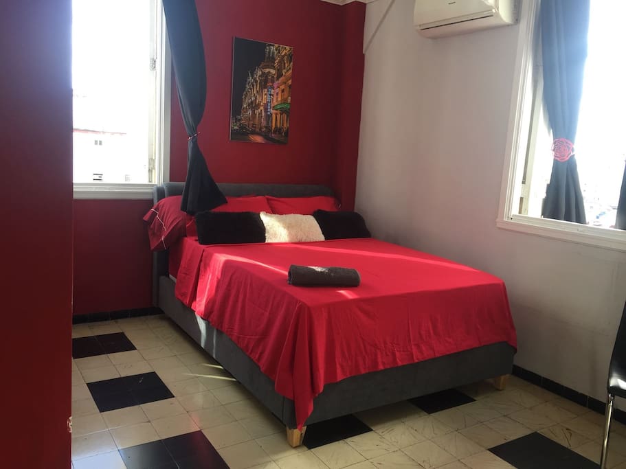 Bedroom with Queen size bed and comfortable mattress, from the windows an spectacular view of the city and the sea.
