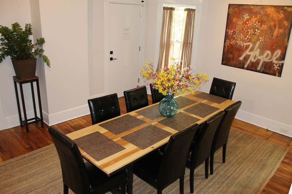 The living area opens to the dining table with room for eight.