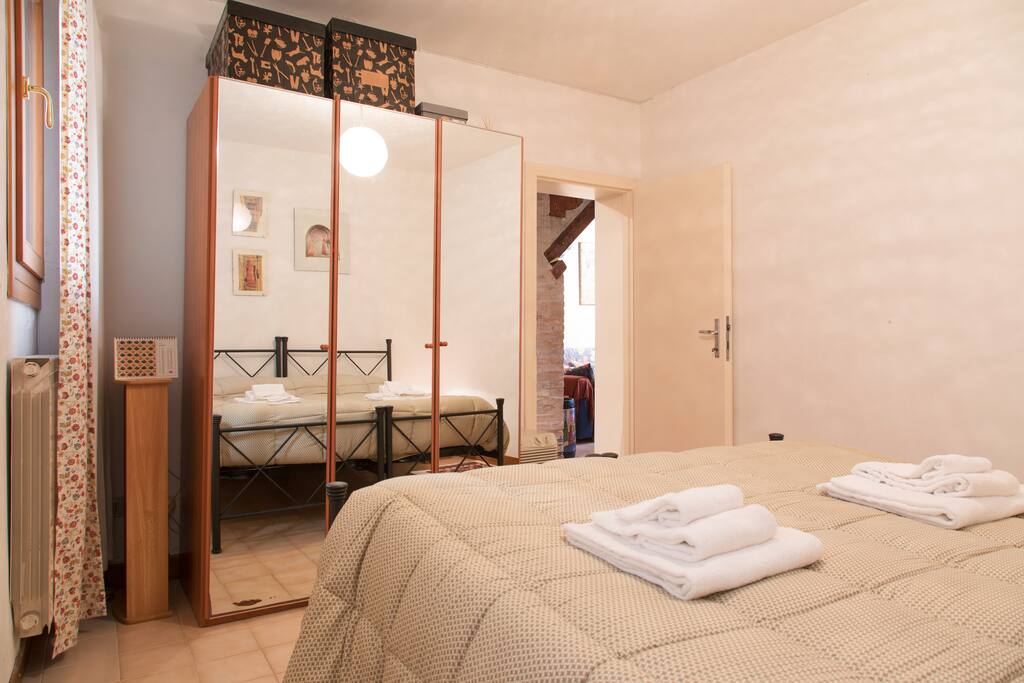 The double bedroom: the bed sofa with soft bed-linen and towels