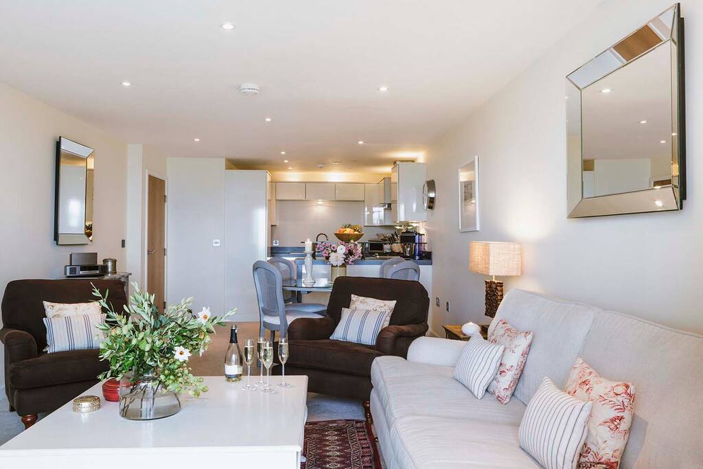 Living area leading onto open plan dining and kitchen area