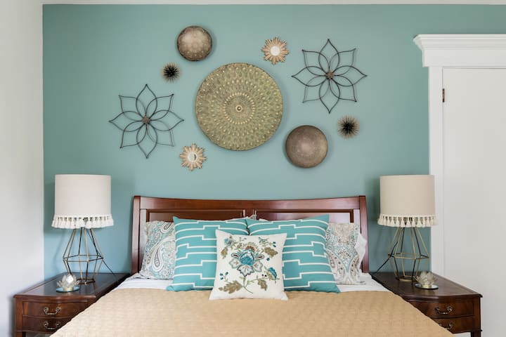 The Primary Bedroom colors are restful and elegant; the perfect getaway yet conveniently located on the main floor and includes an en-suite bathroom.