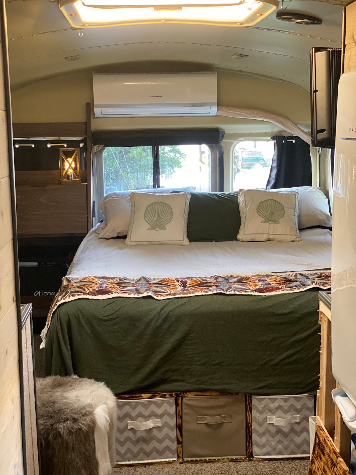 Cozy queen bed for sleeping, right below AC unit! The doors to the back also open!