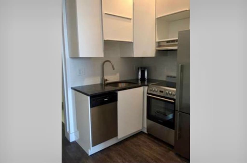 Full Kitchen with dishwasher, full refrig, coffee maker, microwave, stove and oven.