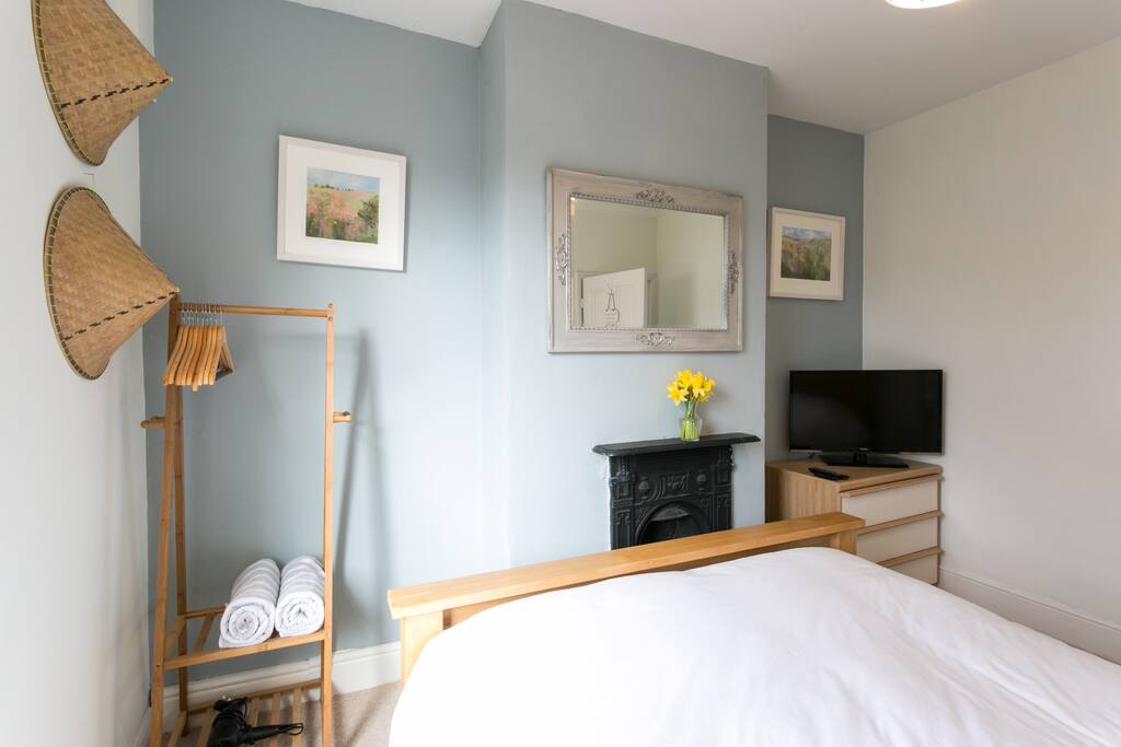 Clothes rail with hangers and John Lewis towels