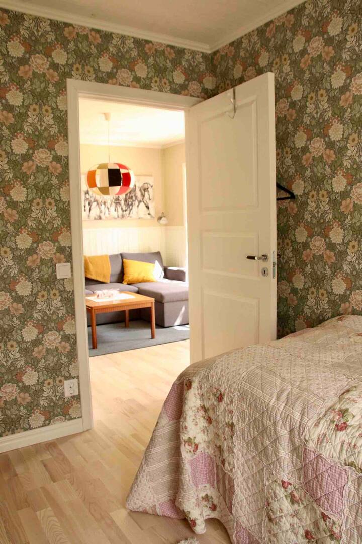 The bedroom is separate with a door that can be closed.